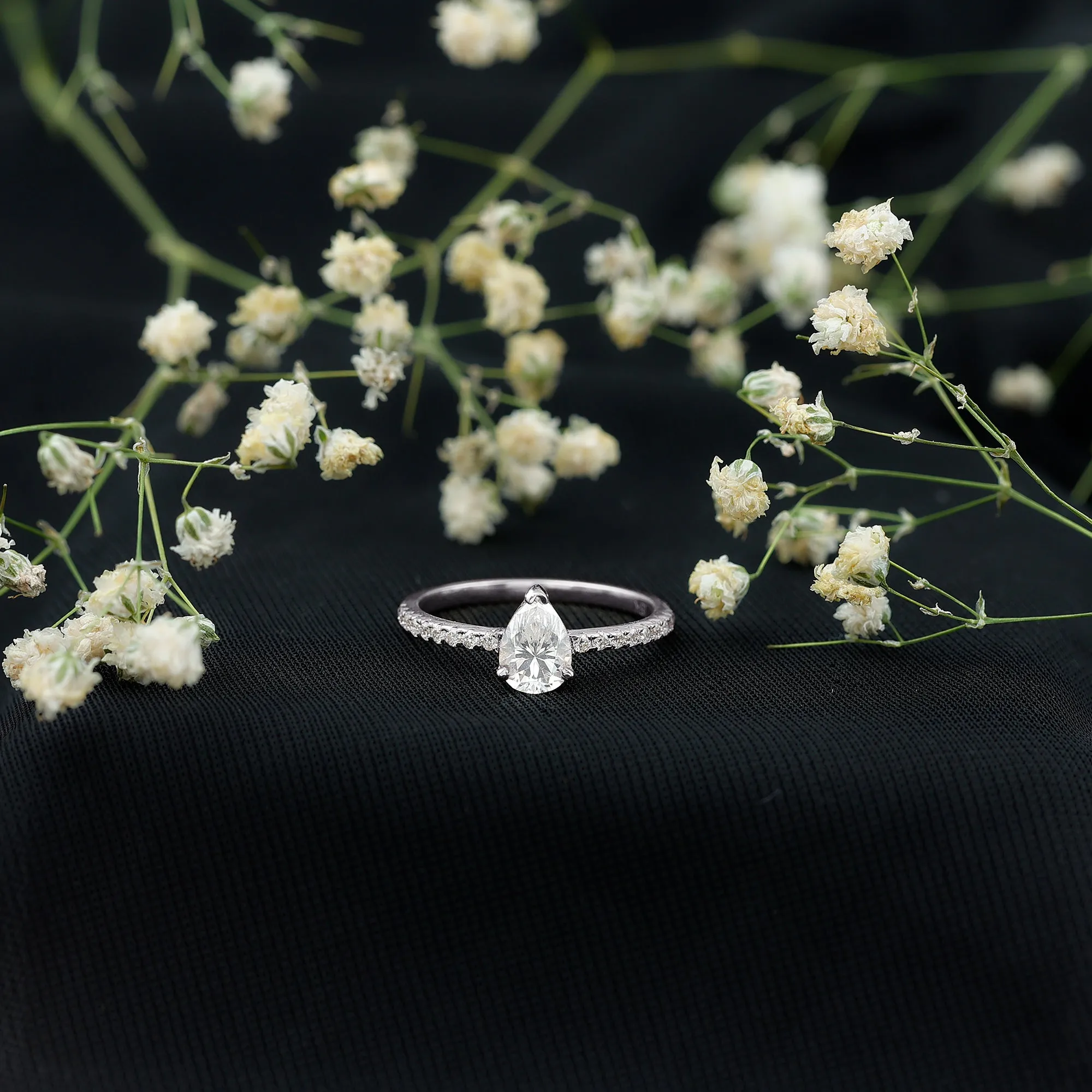 Pear Cut Moissanite Solitaire Ring with Side Stones