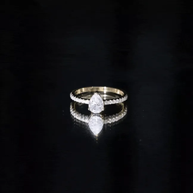 Pear Cut Moissanite Solitaire Ring with Side Stones