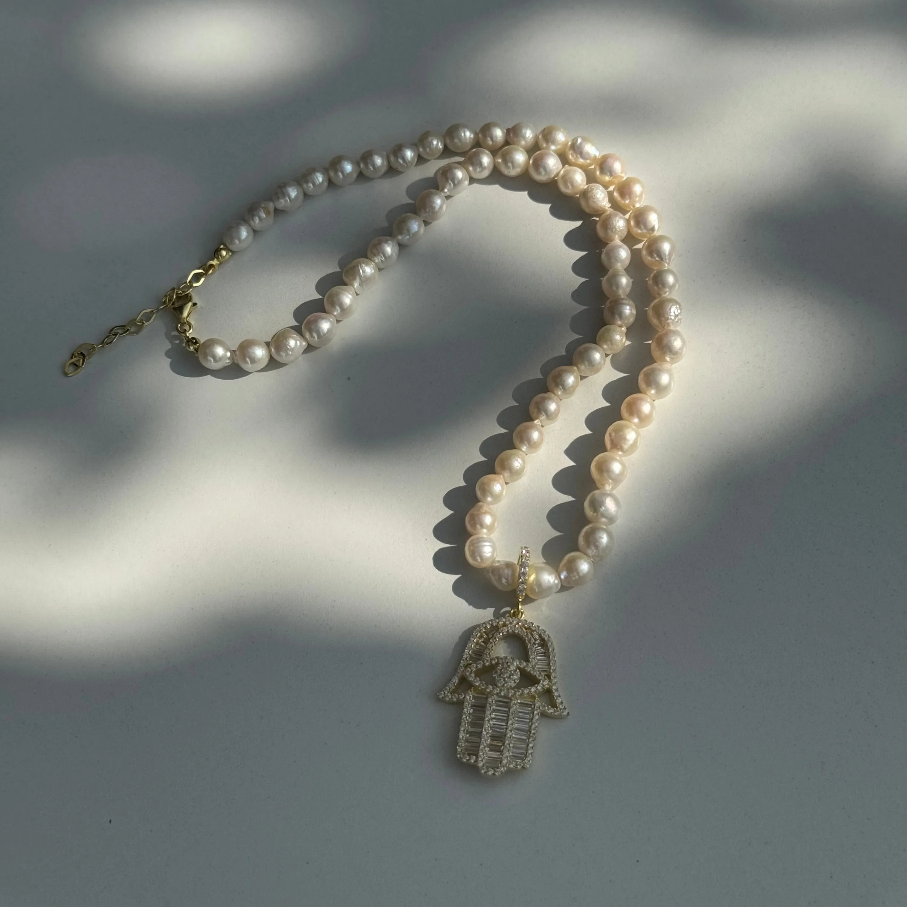 Pearl beaded baguette hamsa necklace