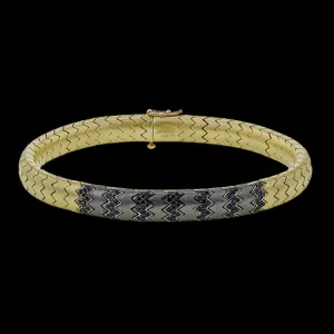 This 14k gold and titanium bracelet contains .67 ctw of black diamonds for the perfect edgy touch.